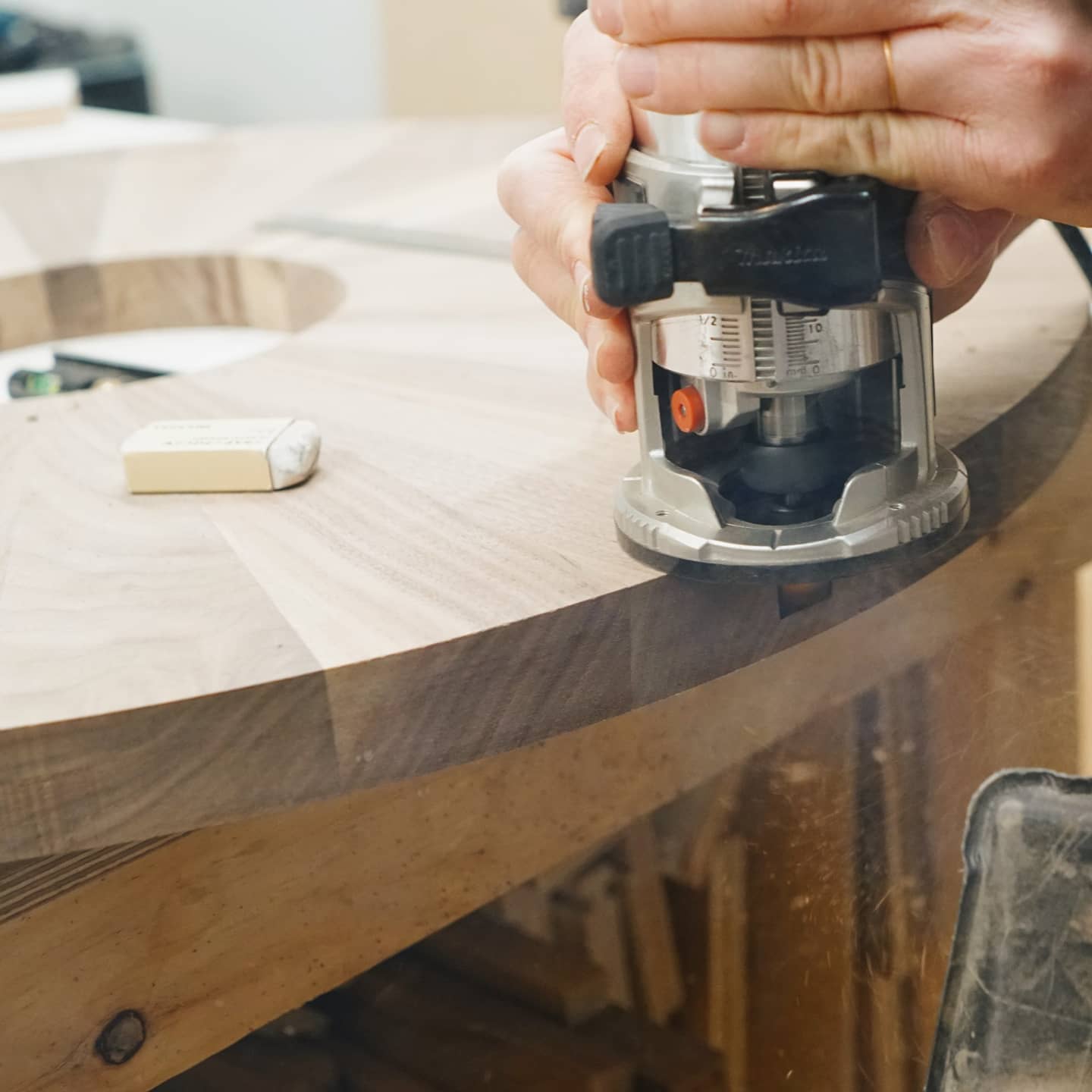 May 25th, 2021: Some behind the scenes from our circular coffee table build! Pictured here is the process of routing out the leg inserts in the table top.